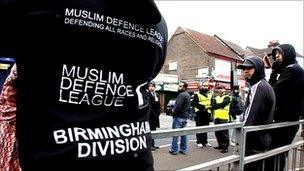 A man wearing a Muslim Defence League top