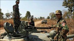 Cambodian soldiers stand on a tank near the Preah Vihear temple in Preah Vihear province, 6 Feb