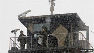 South Korean marines stand guard at a guard post on Yeonpyeong island