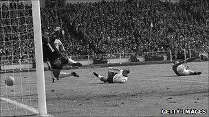 Geoff Hurst scoring his controversial second goal in the 1966 World Cup final