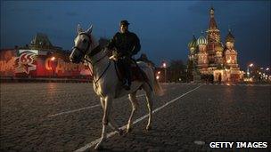 A Turkmen soldier rides a white Akhal-Teke horse during a Victory Day parade rehearsal on Red Square in Moscow, Russia on May 2, 2010.