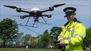 Police officer operating an unmanned aerial system