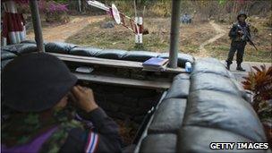 Thai soldiers stand alert at a checkpoint at the 11th-Century Preah Vihear temple