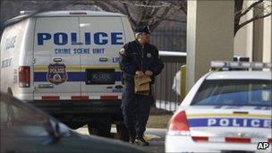 A Philadelphia police standing outside a Hampton Inn in Philadelphia, 8 Feb 2011