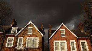 Houses under black sky