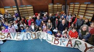 Local residents demonstrate against the potential closure of a library near Milton Keynes