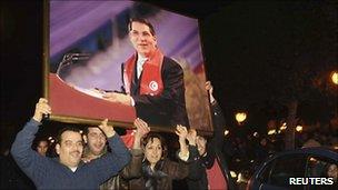 Tunisians celebrating the overthrow of President Ben Ali - 13 February 2011