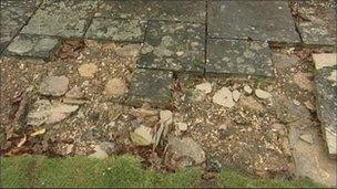 Damaged paving slabs