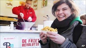 A student with chips in Louvain-la-Neuve