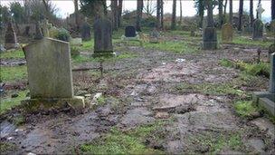 Milltown cemetery with muddy areas