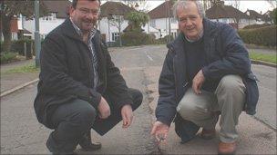 Mr Wales and Mr Mattey (right) at a pothole