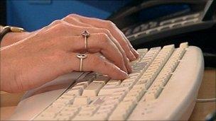 person typing on keyboard