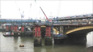 Blackfriars station under construction, showing the piers of the first Blackfriars Railway Bridge