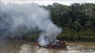 River dredger burning after Peruvian military operation in Madre de Dios region - 19 February 2011