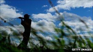 Tiger Woods tees off on the Old Course, St Andrews