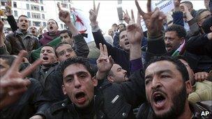 Algerian protesters chant slogans during a demonstration in Algiers, 12 February 2011