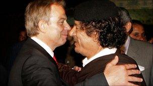 Tony Blair hugs Colonel Gaddafi