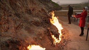 Naturally occurring fires light up a hillside near Baku