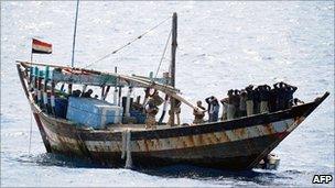 British military personnel securing the deck of a Somali pirate vessel