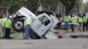 Truck fallen into road cave-in in US