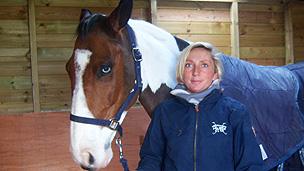 Phoebe Buckley standing next to a horse called Charlie