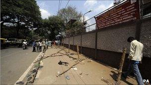 Shoes and barriers on the pavement after cricket fans clashed with police