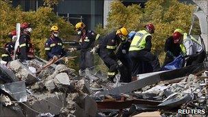 Search crews pull a body from the collapsed CTV building in Christchurch - 24 February 2011