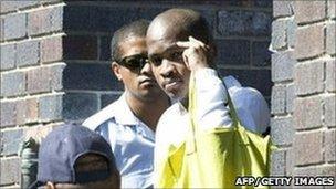 Mziwamadoda Qwabe (R) leaving Wynberg Magistrates' Court on 2 February 2011