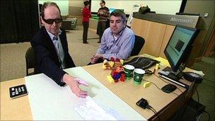 Rory Cellan-Jones shakes hands remotely, using a 3D projection