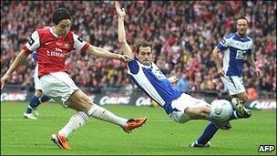 Samir Nasri (left) shoots for goal for Arsenal in the final