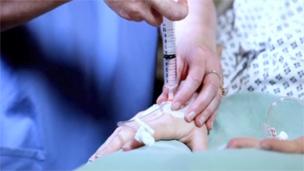 Drugs are injected into a patient's hand