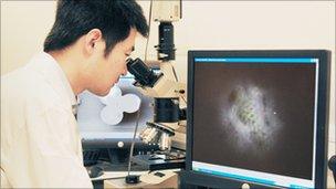 Wei Guo with "super-resolution" microscope