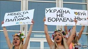 Activists of Ukrainian feminist movement Femen demonstrate in front of marriage registration office in central Kiev on 1 March 2011