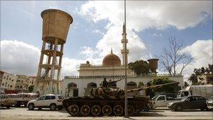 A Libyan army tank guards a traffic intersection in Tripoli, 1 March