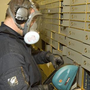 Officer breaking into one of the boxes