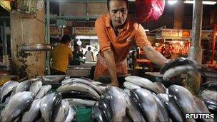 A vendor selling fish in Manila