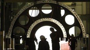 men inspecting turbine