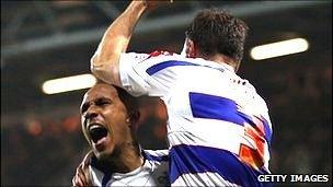 Clint Hill of QPR celebrates scoring a goal with Fitz Hall