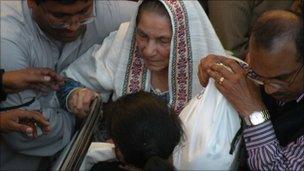 The mother of Shahbaz Bhatti arrives for his funeral