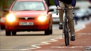 A cyclist rides on a bike lane