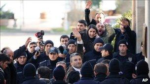 Turkish journalists Nedim Sener (C) and Ahmet Sik (far L) arrive in court (5 March 2011)