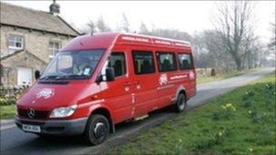 One of the little red buses