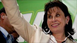 Guatemalan first lady Sandra Torres de Colom waving to supporters after announcing her candidacy