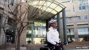 A police officer standing outside the Arizona courthouse