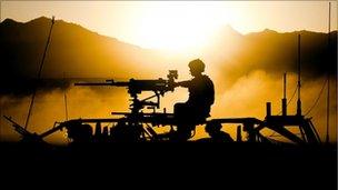 Silhouette image of Royal Marines in Afghanistan