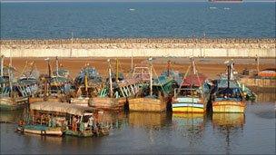 Deep-sea trawler boats stationed along the coast in a fishing village in Tamil Nadu