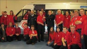Kent Police presenting the minibus to KSAR volunteers