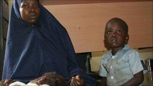 Yakaka, 20, and her two children, in police custody