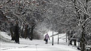 A woman walking in the snow in Denny, central Scotland