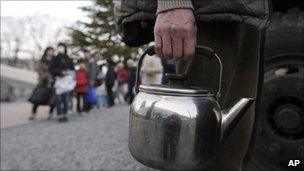 Residents queue for emergency water supplies in Koriyama